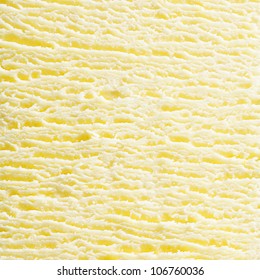 Macro abstract background of the surface texture of scoop of fresh creamy frozen vanilla icecream in square format. For ice-cream concept look at my portfolio