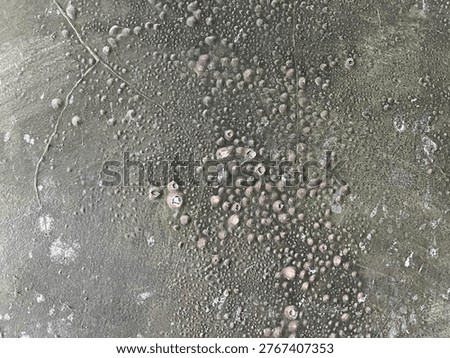 Macro Abstract Texture of Weathered Metallic Surface with Corroded Bubbles and Gritty Gray Patina