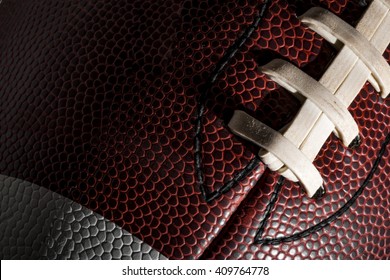 Macro Of A American Football Ball With Visible Laces, Stitches And Pigskin Pattern