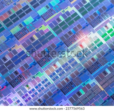 Macro background of silicon wafer semiconductor with neon color, integrated circuits to manufacture CPU and GPU
