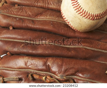 a macro of a baseball in glove