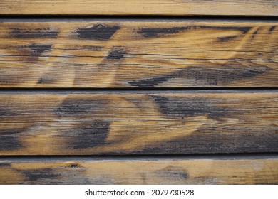 Macro of burnt and brushed wooden planks