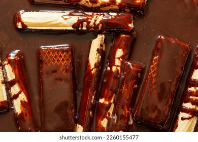 macro chocolate candy background,Close up of molten chocolate and pieces of chocolate bar,macro chocolate,Chocolate Shavings Background,Luxury milk and dark chocolate truffles  - Shutterstock ID 2260155477