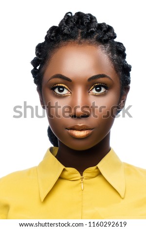 Macro close up beauty portrait of attractive young african woman.Front view of girl looking at camera isolated against white background.