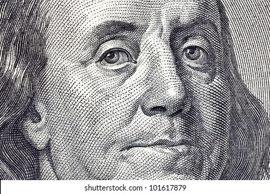 Macro Close Up Of Ben Franklin's Face On The US $100 Dollar Bill.