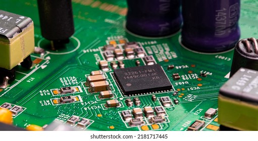 Macro Close up of components and microchips on PC circuit board of modem router	