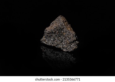 Macro Close Up Image Of Raw Material Platinum And Chrome Ore Rock Isolated On Black Reflective Background