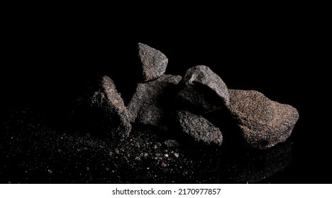 Macro Close Up Image Of Raw Material Platinum And Chrome Ore Rock Isolated On Black Reflective Background