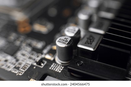 Macro close up of a modern computer gaming motherboard and graphics adaptor circuit parts
