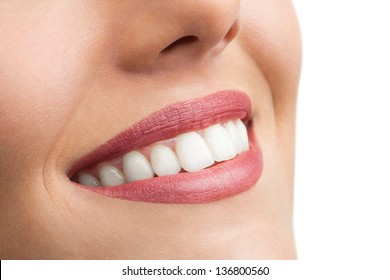 Macro Close Up Of Perfect Female Teeth Isolated On White.