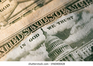 A Macro Close Up Photo Emphasizing The Inscription In God We Trust Printed On The Back Of A United States Ten Dollar Bill With Selective Focus On The Words In God We Trust.