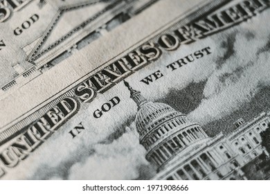 A Macro Close Up Photo Emphasizing The Inscription In God We Trust Printed On The Back Of A United States Ten Dollar Bill With Selective Focus On The Words In God We Trust.