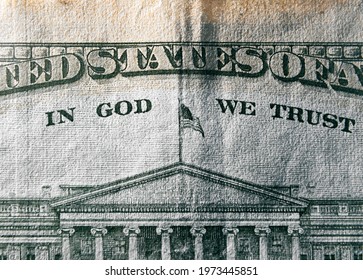 A Macro Close Up Photo Emphasizing The Inscription In God We Trust Printed On The Back Of A United States Ten Dollar Bill With Selective Focus On The Words In God We Trust.