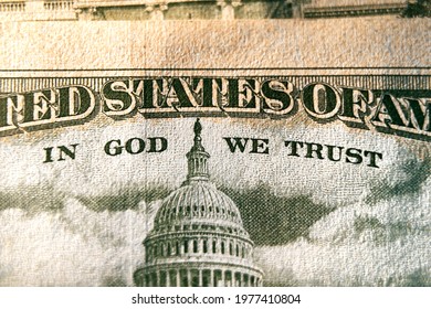 A Macro Close Up Photo Emphasizing The Inscription In God We Trust Printed On The Back Of A United States Ten Dollar Bill With Selective Focus On The Words In God We Trust.