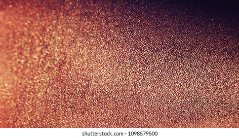 Macro Close Up Photo Of Shiny And Sparkle Bronze Skin Texture. Cosmetics And Sun Tan Concept. Bronzer Or Glossy Body Oil Swatch In Make Up.