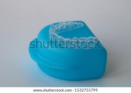 Macro close up of a plastic teethguard to stop wear due to teeth grinding at night.