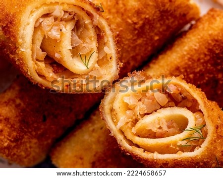 macro close up of the polish traditional snack food, called krokiety which are fried  crepes with sauerkraut filling with mushrooms Zdjęcia stock © 
