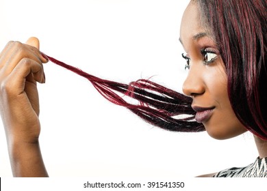 Macro Close Up Portrait Of Young African Woman Looking At Dry Edges Of Dyed Hair.Isolated On White Background.