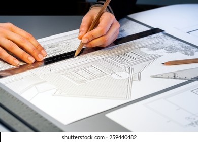 Macro Close Up Of Quantity Surveyor Working On Architectural Layout.