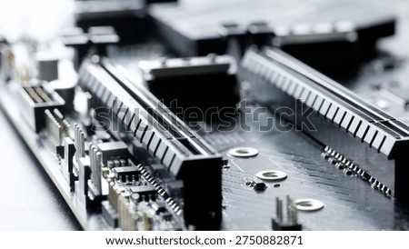 Macro close up of two PCI Express x16 slots on a modern computer motherboard. Expansion connectors for graphics cards, workstation upgrades, and high performance PC builds. Photo