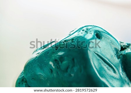 Macro Close Up View of Raw Turquoise Rock Texture Showing Curved Contour and Imperfect Pores