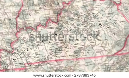 Macro close up of a vintage map highlighting Kentucky in the United States, showcasing detailed cartography, major cities, river valleys, and classic antique textures ideal for travel, history, and navigation themes.