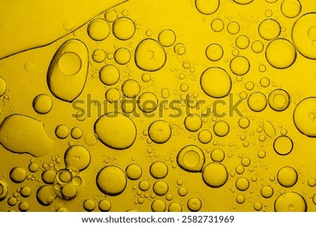 Macro close up of yellow bubble texture,Macro microscope yellow bubble texture, Close-up Yellow bubbles and drops oil background . golden Yellow water bubbles, close up golden oil drop for celebration