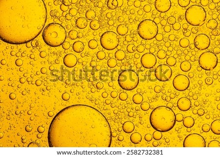 Macro close up of yellow bubble texture,Macro microscope yellow bubble texture, Close-up Yellow bubbles and drops oil background . golden Yellow water bubbles, close up golden oil drop for celebration