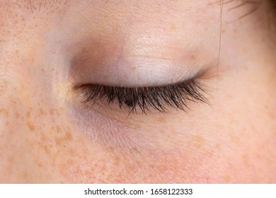 Macro Of A Closed And Relaxed Girl Eye, Details Of The Eyelid In Relief