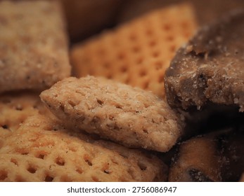 Macro close-up of assorted savory crackers with coarse salt crystals in shallow depth of field