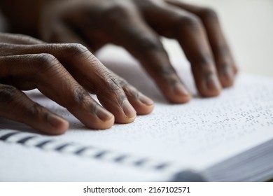 Macro closeup of blind man reading book in braille, accessible education concept, copy space - Powered by Shutterstock