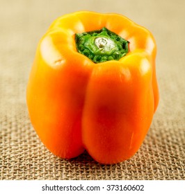 Macro Closeup Of Bright Orange Capsicum Pepper