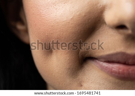 Macro closeup of Caucasian woman smiling having dimples. Beauty concept.  
