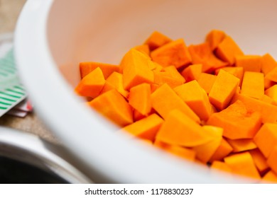 Macro Closeup Of Diced Butternut Squash In A White Bowl