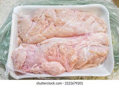 Macro closeup of fresh whole beef sweetbreads thymus organ gland, nutritious ancestral meat food in plastic wrap bag