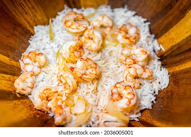 Macro Closeup Of Homemade Basmati Rice And Cooked Whole Large King Jumbo Argentinian Fried Shrimp Seafood With Sweet Onion Slices In Wooden Bowl Plate
