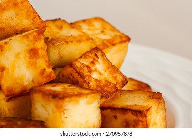 Macro Closeup Image Of Delicious Ghee Fried Indian Paneer (cottage Cheese) Cubes On A Plate. Shallow Depth Of Field.