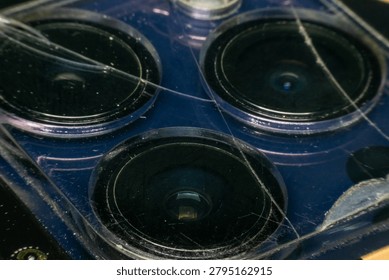 Macro closeup of multiple camera lenses inside an electronic device showing optical components precision engineering and modern imaging technology