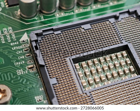 Macro closeup of open LGA CPU socket on green motherboard showing dense gold contact pins and a single bent pin, computer hardware damage and repair troubleshooting concept, bent CPU pins concept