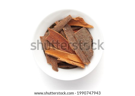 Macro close-up of Organic cinnamon ( Cinnamomum verum) or dalchini on white background. Pile of Indian Aromatic Spice. Top view