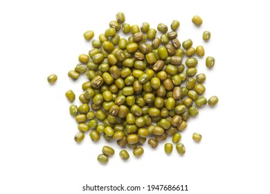 macro Close-up of Organic green Gram (Vigna radiata) or whole green moong dal cleaned on a white background. Top view