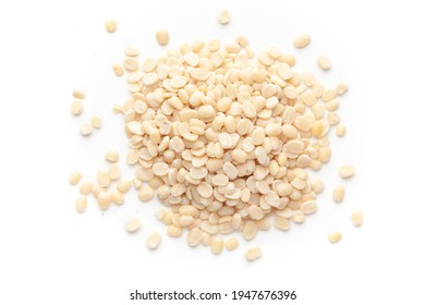 macro Close-up of Organic split polished white urad dal (Vigna mungo) cleaned on a white background. Top view