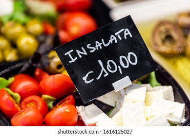 Macro Closeup Of Packaged Salad Display With Tomatoes, Olives And Feta Cheese In Famous Florence Italy Firenze Centrale Mercato With Sign For Expensive Price