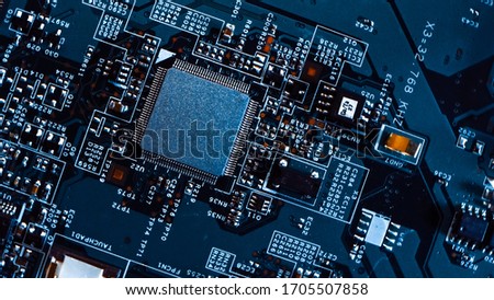 Macro Close-up Shot of Microchip, CPU Processor on Printed Circuit Board / Computer Motherboard with Components Inside of Electronic Device, Parts of Supercomputer.