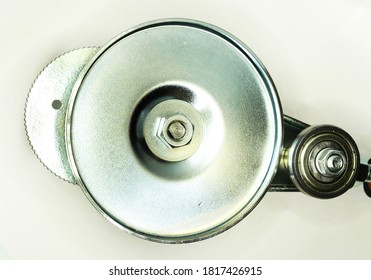 Macro Closeup Of Silver Metal Canning Machine. Nut, Bolt And Thread. Metal Disc