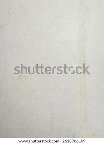 A macro close-up view of aged stamp paper reveals faint vertical lines, light discolorations, and subtle imperfections characteristic of vintage philatelic material.