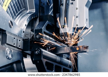 Macro CNC laser machine cutting sheet metal with light spark. Technology plasma industrial banner, Blue steel color