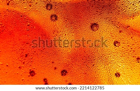 Macro cola texture,cola with ice food background, cola close-up, design element. beer macro bubbles, ice, bubble, background, ice cubes, abstract backgrounds 