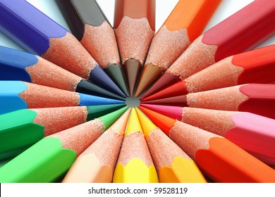Macro of colored pencils in a circle.