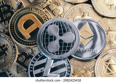 Macro Concept Of Dodge Coin, Ripple, Litecoin And Ethereum Placed On Top Of A Pile Of Bitcoins. Business And Financial Concept